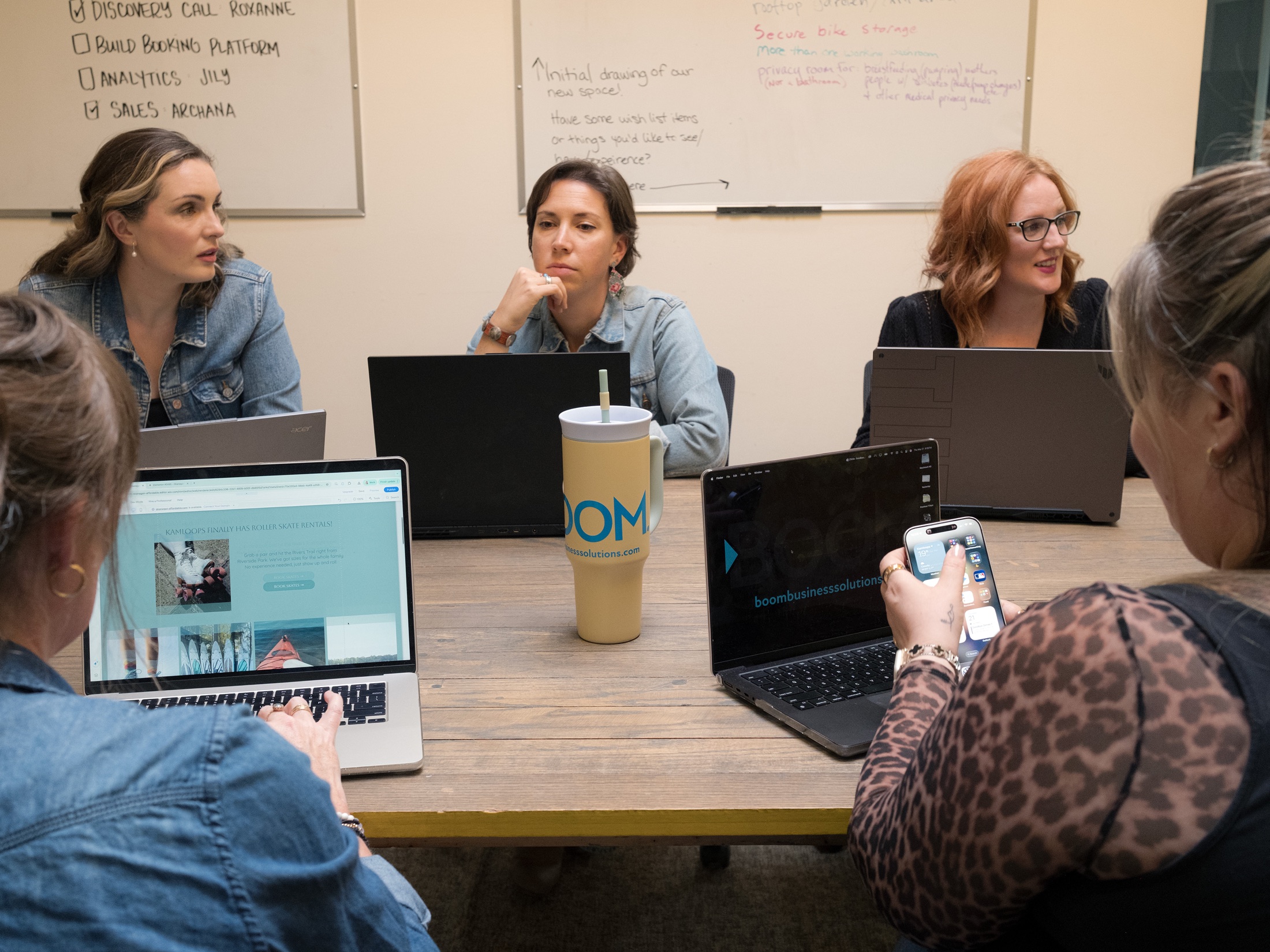 The Boom team collaborating around a meeting table