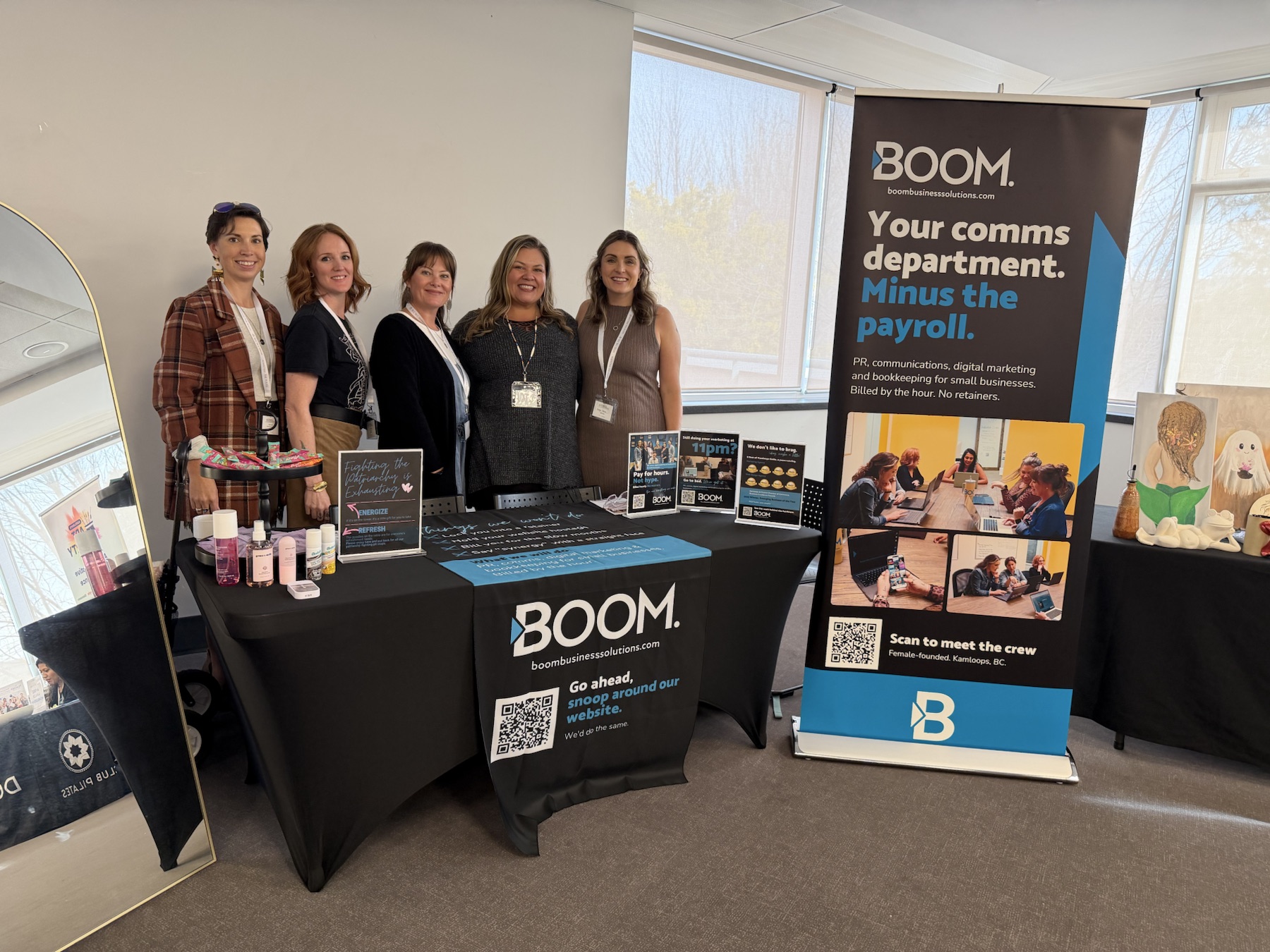 The Boom Business Solutions team together at their booth